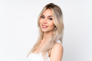 Teenager blonde girl over isolated white background . Portrait