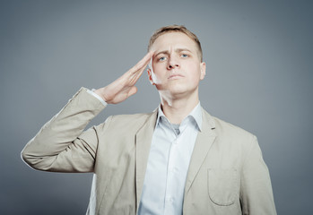 man salutes put his hand to his head