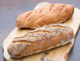 Two pieces of bread on a board