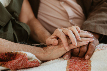 Romantic couple holding hands - Powered by Adobe