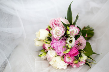 Beautiful wedding bouguet made of white and pink peonies.