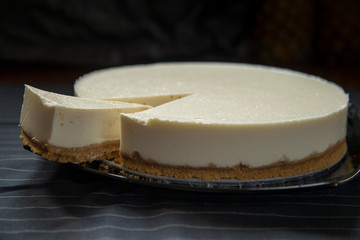 Slice of cut cheesecake.