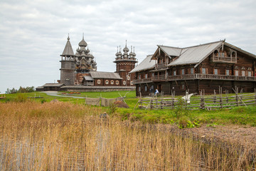 Kizhi island, Onega lake, Karelia, Russia.  In the foreground Orthodox Church of the Intercession of the Virgin in Kizhi Pogost.