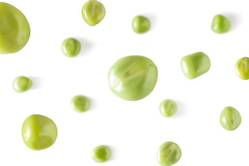 Falling peas on a white background. Scattered peas on a light background