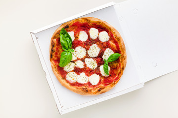 pizza Margherita in a box for delivery, advertising or menu