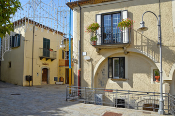 A narrow street among the picturesque houses of a mountain village