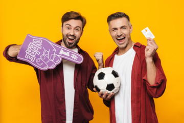 Two attractive young men friends wearing casual clothes