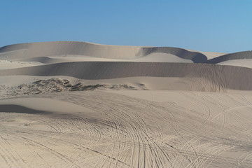 The White Sand Dunes of Mui Ne. Desert with traces of ATVs