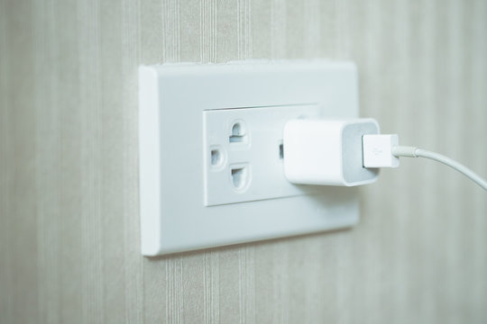 electrical outlet on white wall