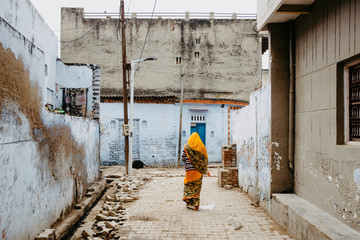Woman walking down the street in Agra, India