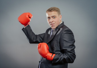 businessman in boxing gloves isolated