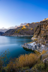 Naklejka premium mountain landscape with a lake at sunset
