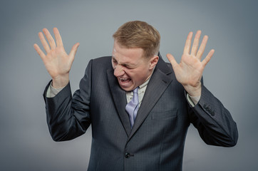 frightened  and shocked business man looking up, fear of something, high prices on market, high or...