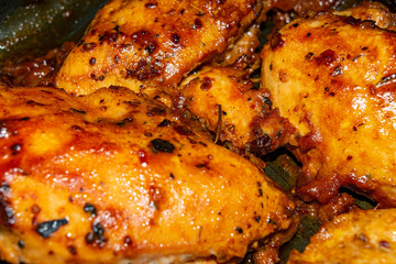 Chicken breast baked with spices in the oven. Close up.