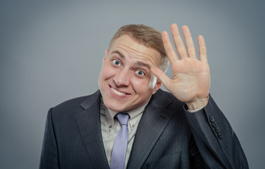 Closeup portrait of happy bashful socially awkward young man waving with hands, isolated. Positive emotion facial expression feelings, situation, reaction - 339627269