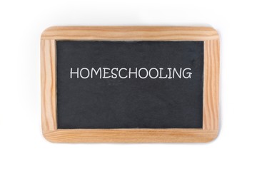 blackboard with the word homeschooling isolated on white background.