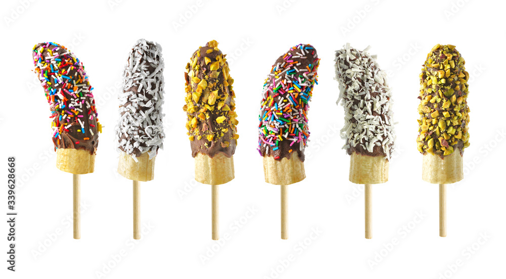 Poster frozen chocolate dipped banana pops with an assortment of sprinkles, nuts and coconut isolated on a 