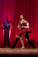 Duet young girl ballerina and a young man dancing ballet performance on stage in a theater © Kozlik_mozlik