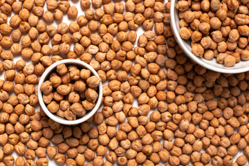 Chickpeas in white cup close up. Top view