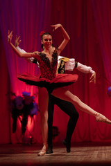 Duet young girl ballerina and a young man dancing ballet performance on stage in a theater © Kozlik_mozlik