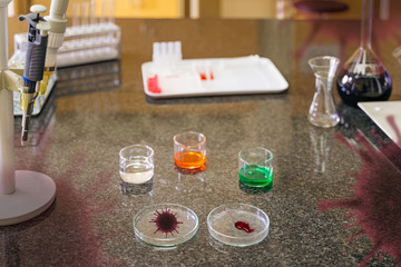Coronavirus infected blood sample in lab glassware in laboratory ready for research for covid 19 vaccination with translucent virus cell graphic