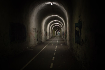 Camino de Santiago. Way of St. James. Tunnel in a forest in Spain. Long stone corridor. Passage...