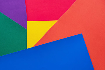 Abstract and colorful background of randomly arranged elements of red, orange, yellow, blue, green and purple.