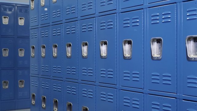 Rows of lockers in gym locker room. Changing room for a public pool. 
