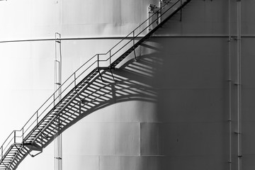 white tanks in tank farm with blue sky