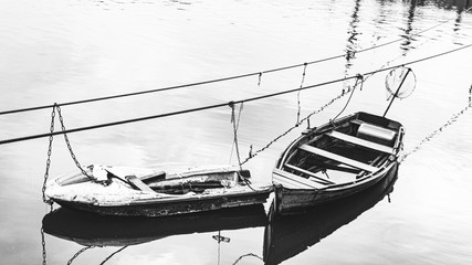 old boat on the river black and white