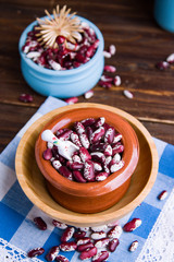 Violet with dots beans in ceramic bowl. Swallow beans. Vegetables for healthy eating. Organic food.