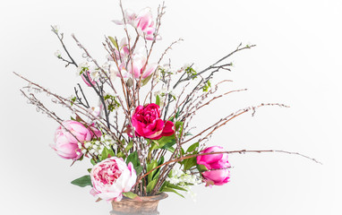 Wild modern spring bunch with pink peonies. Close-up.
