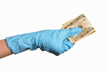 Hand in blue protective gloves with money isolated on white background.