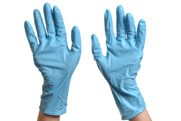Hands in blue protective gloves over white