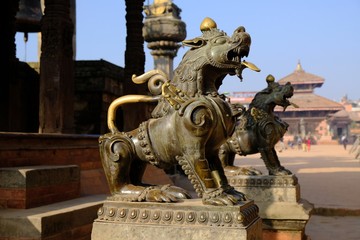 Guardian lions on the steps of a temple at Durbar Square, Bhaktapur, UNESCO World Heritage Site, Kathmandu Valley, Nepal, Asia