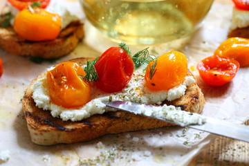 Bruschetta with ricotta cheese and sun-dried tomatoes with provencal herbs.