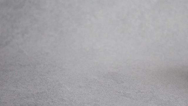 White ffp3 face mask with a valve on a light background