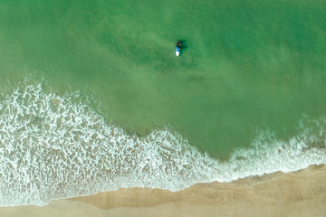 surf instructor and woman learning extreme water sport in Goa