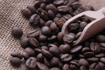 Close up of raw coffee beans on table.