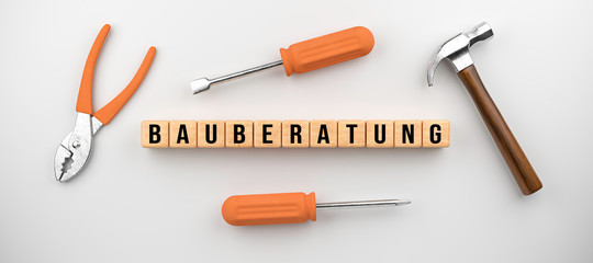 set of tools and cubes with German message for CONSTRUCTION CONSULTING on white background