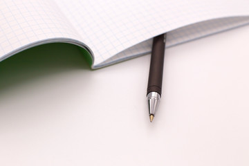 Fountain pen and Notepad on a white background
