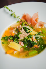 soup with vegetables and prosciutto