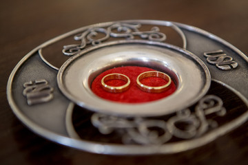 Wedding rings on a ceremony plate