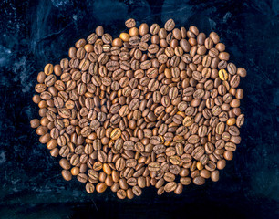 
fried coffee beans background, top view