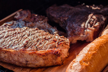 Close-up of beef T-Bone-Steaks grilling on a barbecue