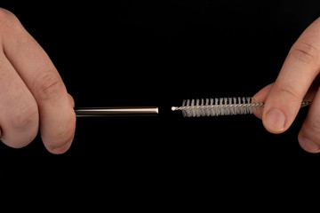 Reusable Metal Straws with Portable Case - Stainless Steel, Eco-Friendly Drinking Straw Set with  Cleaning Brushes. Stainless Steel Metal Straws, Reusable metal straws on a  black isolated background,