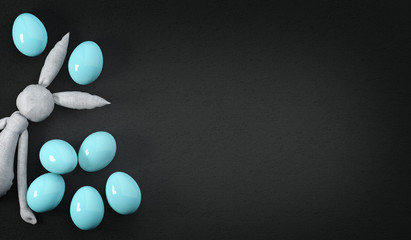 Blue Easter eggs and a rag toy rabbit on a dark background. happy Easter. Easter banner or poster. 3D rendering.