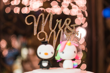 penguin wedding cake topper with Mr and Mrs sign