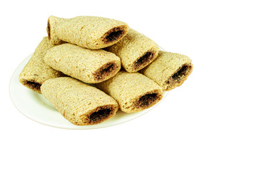 Cereal biscuits with chocolate filling in plate isolated
