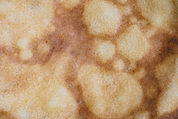 Highly detailed surface texture of a freshly baked pancake